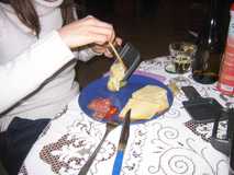 
The raclette being poured on some potato. Yummy.
