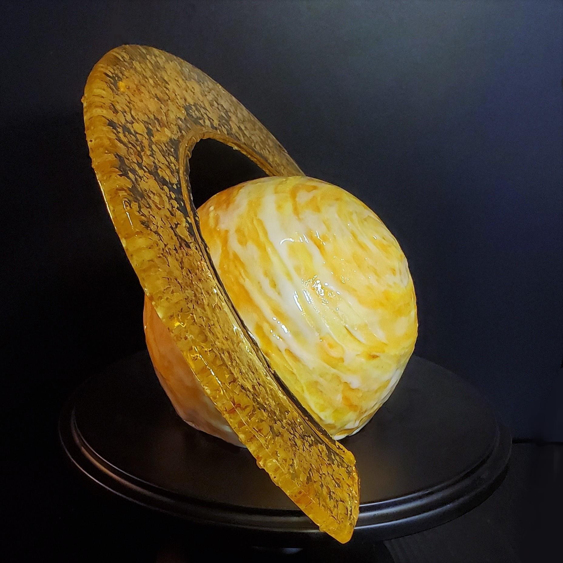 In her free time, graduate student Claire Lamman bakes astrophysics-related cakes and cookies, including this Saturn cake.