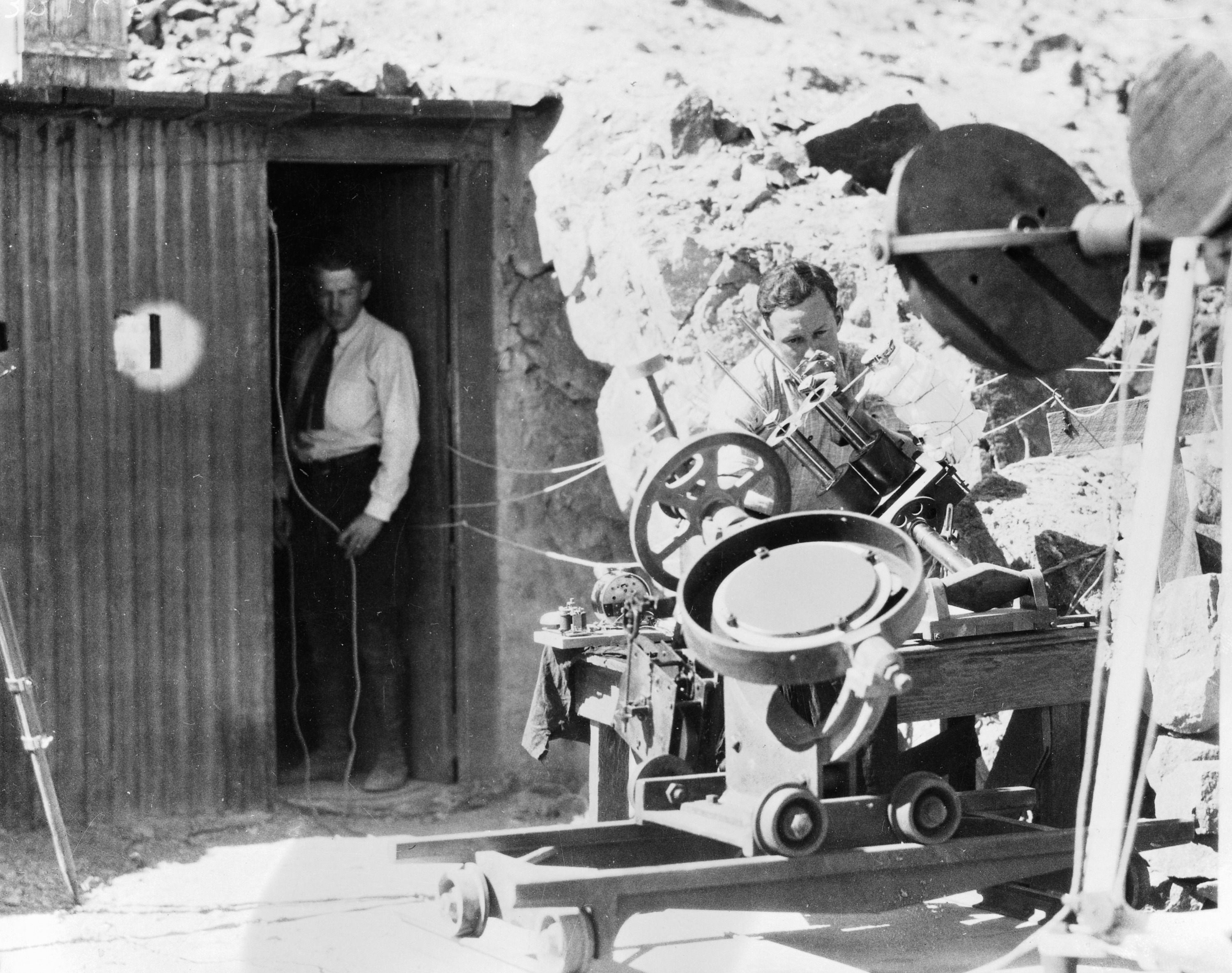 Two men working at the SAO's solar station in Mt. Montezume, Chile.