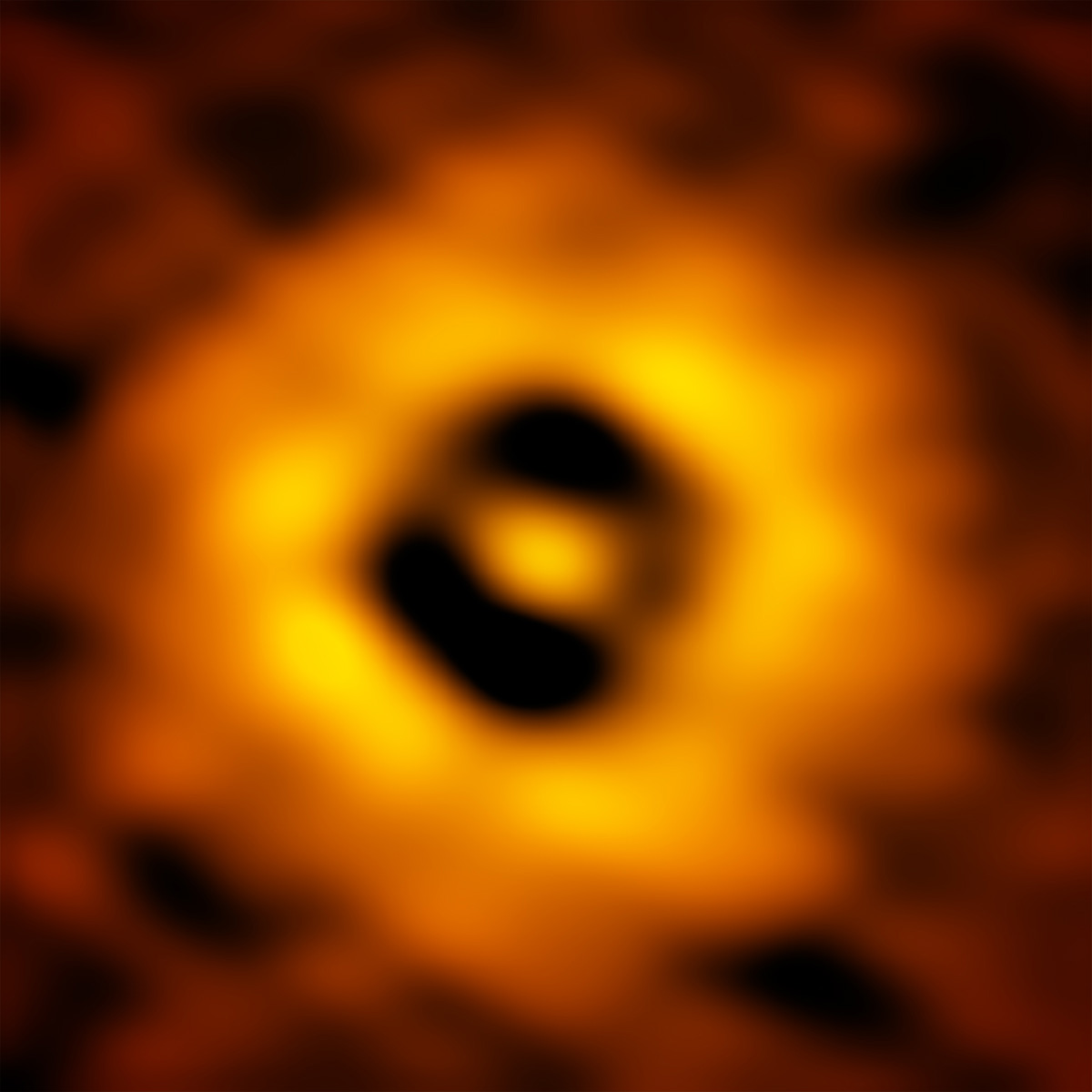 The inner region of the TW Hydrae protoplanetary disk as imaged by ALMA. The image has a resolution of 1 AU (Astronomical Unit, the distance from the Earth to the Sun in our own Solar System). This new ALMA image reveals a gap in the disk at 1 AU, suggesting that a planet with the same orbit as Earth is forming there.