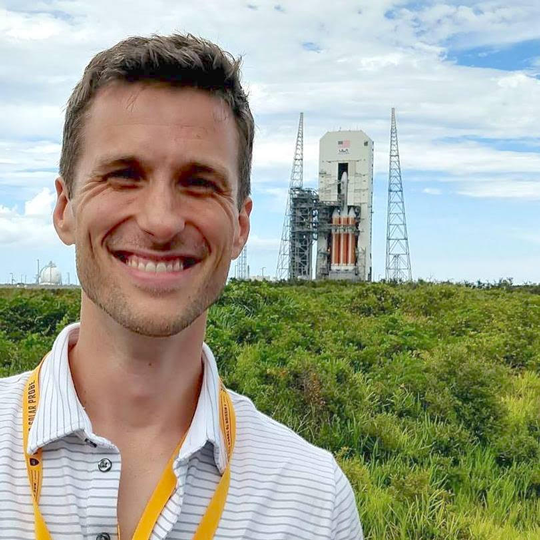 A portrait photo of astrophysicist Michael Stevens.